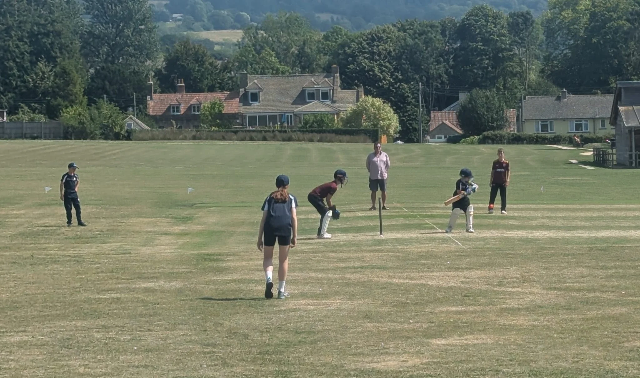 Coach supervising a junior match